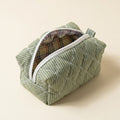 The Essential — Matcha Latte pouch, open to show the checked lining