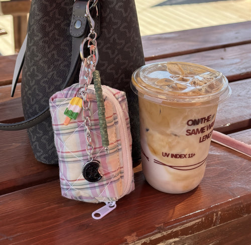 Pastel Pixel Errand bag charm clipped to a bag